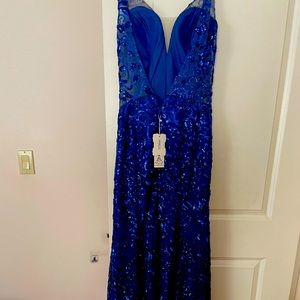 Beautiful, never worn royal blue size 8 prom gown. Free shipping in the US.